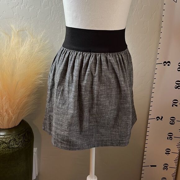 Love Culture wide elastic waistband miniskirt w/ 2 front pockets & faux buttons. - Picture 4 of 8